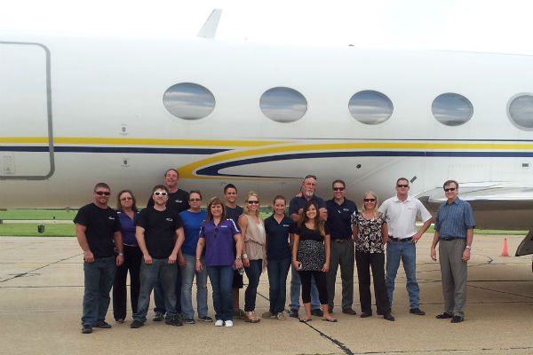 The Pollard Aircraft team standing in front of their newly-acquired Gulfstream GIV business jet. 