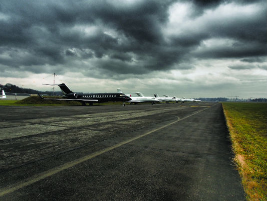 line up of executive jets handled by ExecuJet parked at Dubendorf Airport during the World Economic Forum 2014