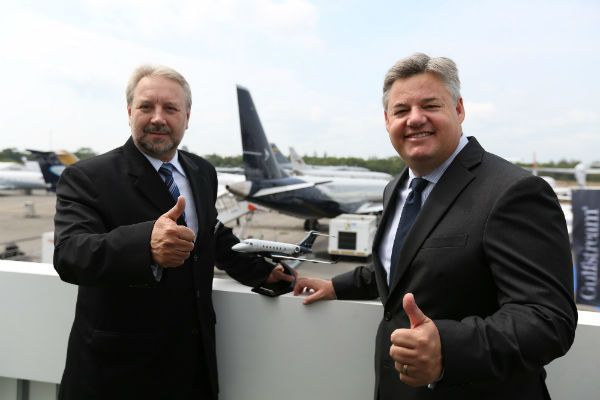 Edson Carlos Mallaco (left) of Embraer and Tony Jones of Hawker Pacific at the Singapore Air Show